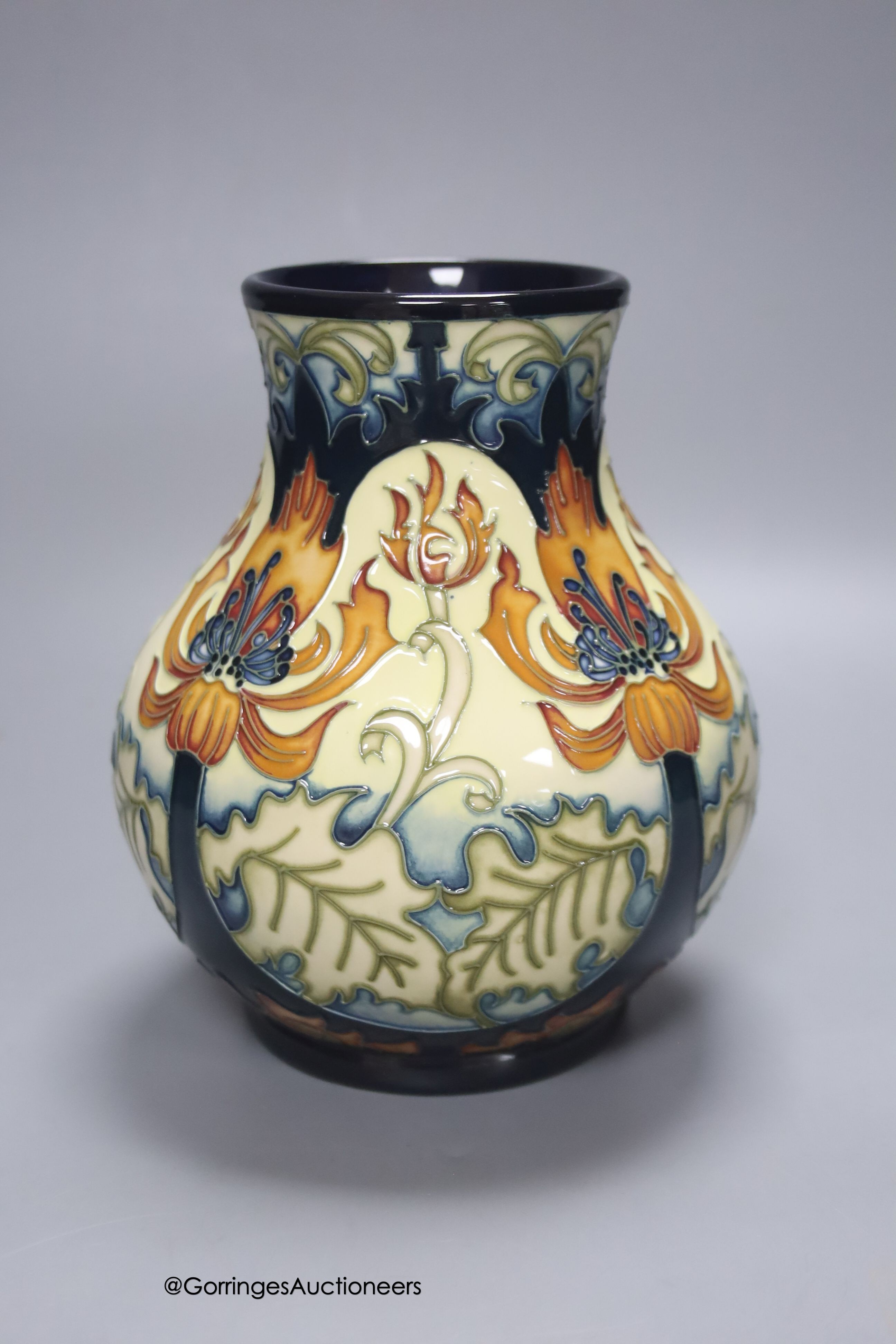 A boxed limited edition Moorcroft pottery vase in the Festive Flame pattern, designed by Kerry Goodwin, painted by Paul Hilditch, signed and numbered 7/100, height 16cm